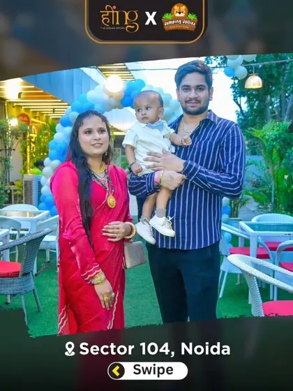 A young family poses for a photo in our decorated outdoor dining area during a birthday party.