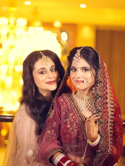 A beautiful portrait of the bride with her sister or friend, capturing a special bond on the wedding day.