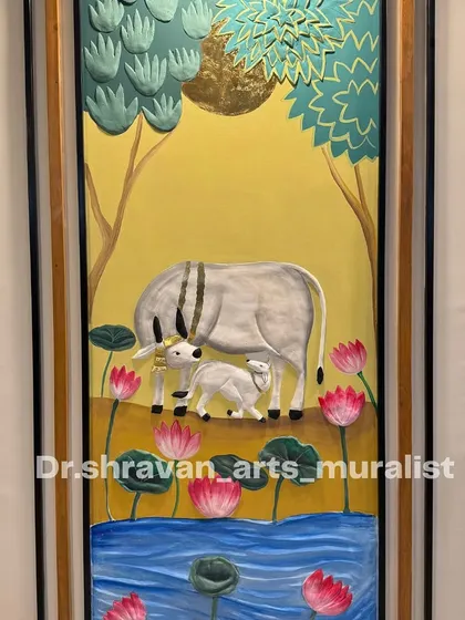 Pichwai in relief mural art! This is a close-up of another traditional piece, showing the cow, calf, and lotuses all sculpted in 3D and then painted. The gold foil sun adds a divine touch.