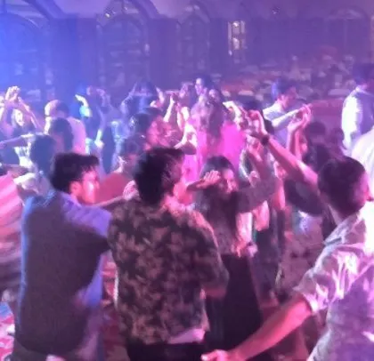 The dance floor is packed with doctors and pediatricians letting loose.