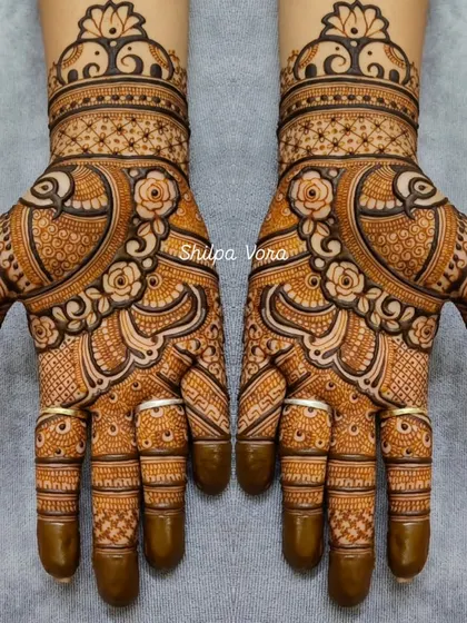 A beautiful symmetrical design combining peacocks and roses, blending traditional and floral elements.
