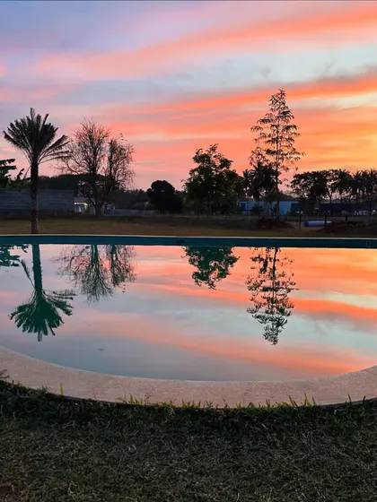 The reflection of a spectacular sunset in our calm swimming pool creates a truly magical moment.
