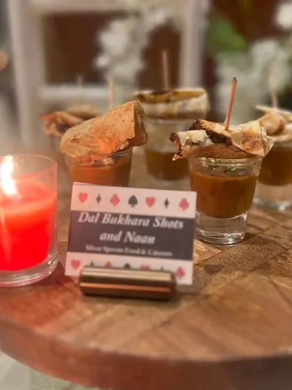 A creative twist on a classic, our Dal Bukhara Shots are served with miniature naans. This innovative presentation is perfect for a modern Diwali cards party.