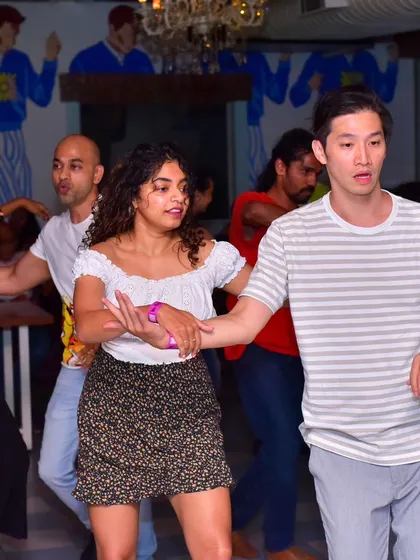 A focused and stylish pair, moving together in sync.
