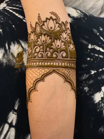 A collection of designs with fresh henna paste, showing the clean lines and 3D effect before the paste dries and falls off.