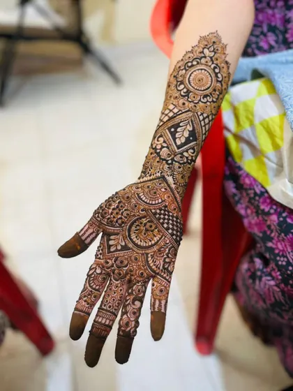This is a detailed view of my intricate bridal henna work. Each design is unique, combining traditional patterns like paisleys and mandalas with fine-line fillers to create a stunning, full-coverage look for your special day.