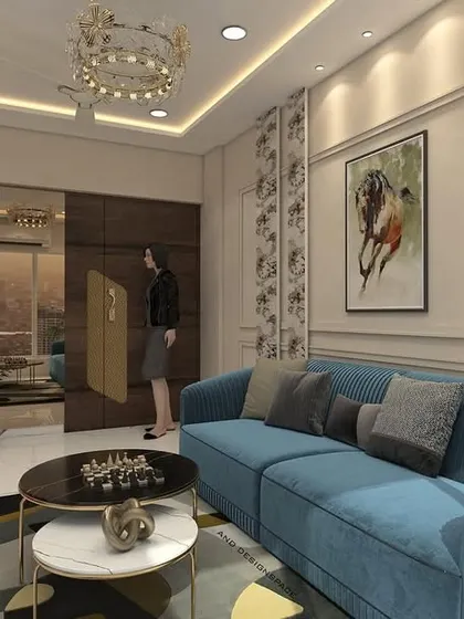 This render for a 2BHK in Bhayandar West shows a compact living room with a bold blue sofa and a TV unit with a red console. The design demonstrates how to use color effectively in a smaller space.