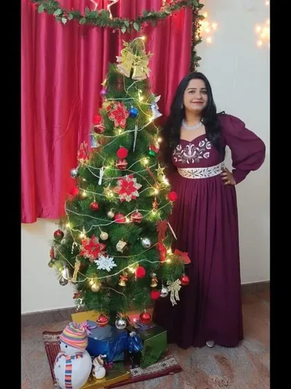 I designed this wine-colored gown with hand embroidery and a detachable belt for a client's Christmas celebration.