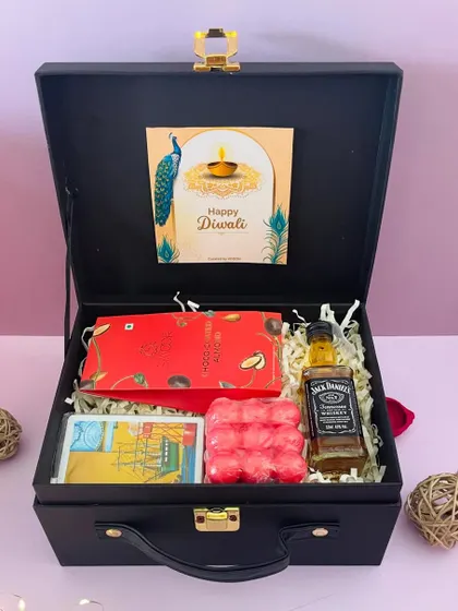 A simple yet elegant hamper for him, with a miniature Jack Daniel's, a chocolate bar, and bubble candles, presented in our versatile black suitcase box.