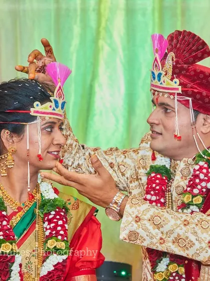 The playful moments are just as important as the solemn ones. This photo captures a fun interaction between the bride and groom during their ceremony.