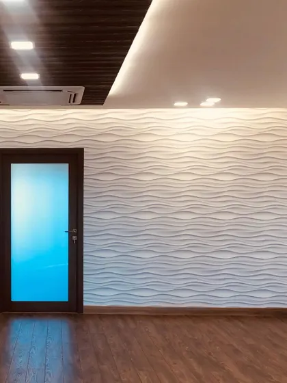 A shot of the 3D wave wall before the furniture was moved in. This textured feature wall is a great way to add interest and a sense of movement to a room.