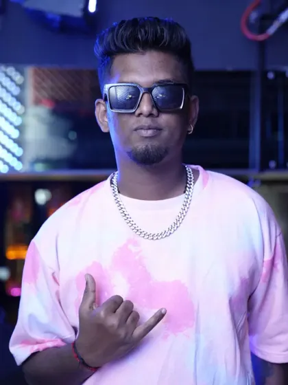 A confident pose in a pink tie-dye shirt. My style is as vibrant and energetic as the music I play.