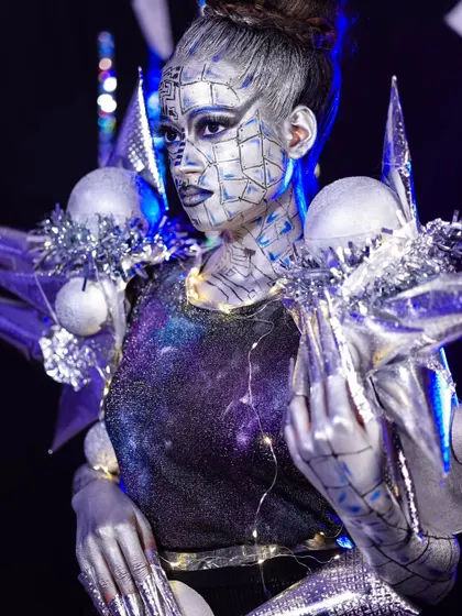 A side profile of the robotic look, showing how the design extends beyond the face to create a complete transformation.