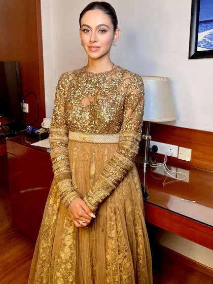 A full-length view of the elegant reception gown, showing how a simple makeup and hair style can be incredibly powerful.