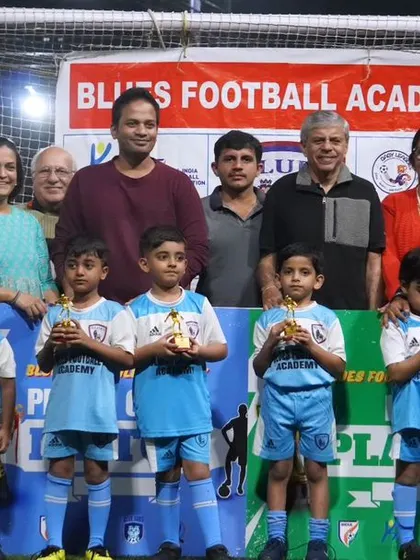 A heartwarming photo of our youngest award winners surrounded by their families. This is what community football is all about.