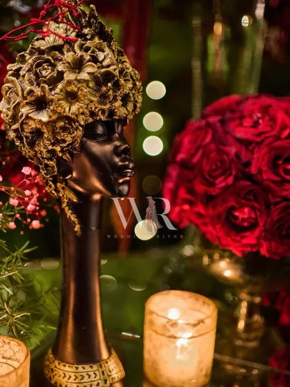 An artistic and unique decor piece. This sculpture of a woman's head with a floral headpiece added a touch of modern art and sophistication to the event's styling.