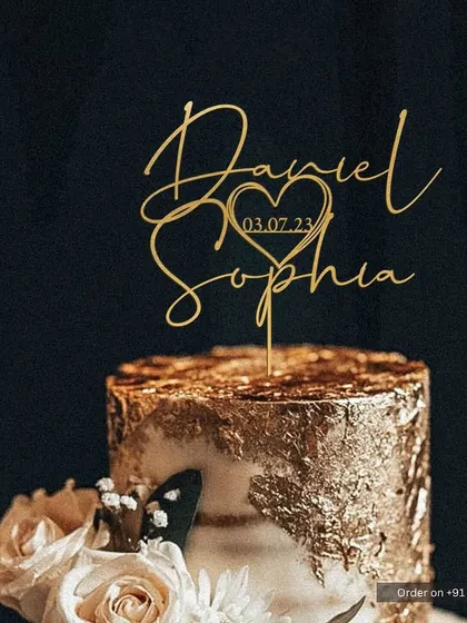 This cake was for Daniel and Sophia's special day, featuring a stunning gold leaf finish. I topped it with a custom-scripted topper that includes their names and wedding date, creating a beautiful, romantic keepsake.