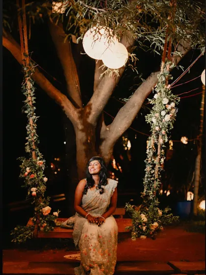 The bride enjoying a quiet moment during her cocktail party. The soft, romantic makeup with a focus on glowing skin and defined eyes ensures she looks effortlessly beautiful from every angle.