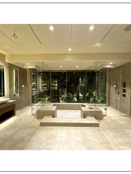This bathroom in our Aamby Valley project is a perfect blend of indoor-outdoor living. We created a spa-like atmosphere with an open-air feel, a luxurious jacuzzi shower, and stunning natural views, all while maintaining complete privacy and comfort.