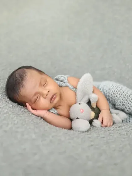 Sleeping soundly with a tiny bunny friend. I have lots of little stuffed animals that are perfect for newborn sessions, adding a touch of sweetness.