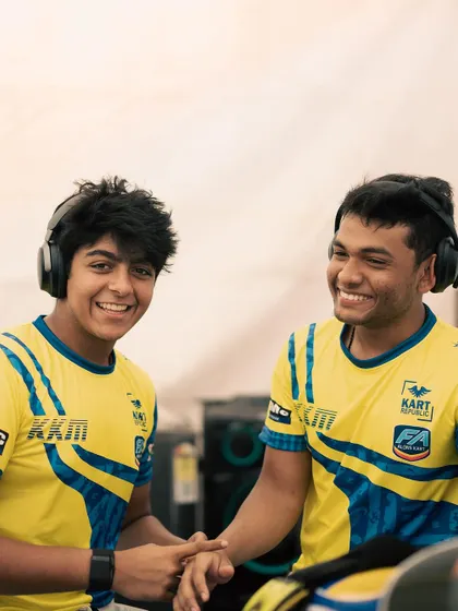 The smiles say it all. Teammates sharing a laugh in their team gear, a great example of the camaraderie we foster within the krew.