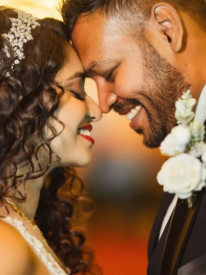 An intimate and happy moment between the couple. Janice's curly hair, styled with a beautiful tiara, looks absolutely regal.