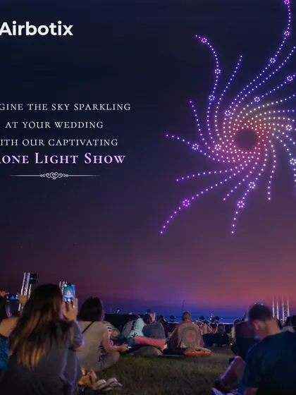A mesmerizing spiral of purple light fills the sky, illustrating the kind of abstract and beautiful formations we can create to add a magical atmosphere to your wedding celebration.
