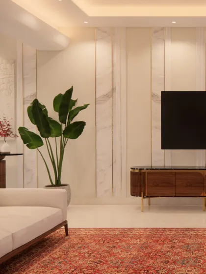This living room draws you in with its quiet refinement. The feature wall combines marble-finish panels with delicate gold inlays for a touch of elegance. A rich wooden TV console and a bold traditional rug ground the space, creating a perfect balance of contemporary style and classic warmth.