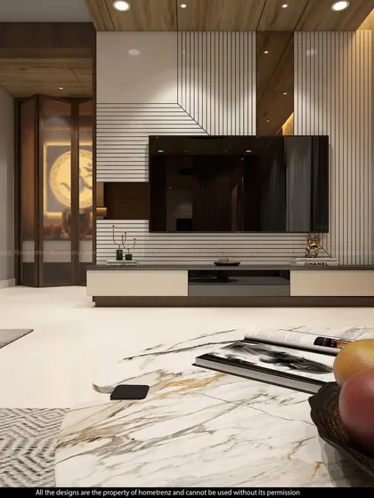 A close-up of a living room TV unit, showing a mix of white and wood-textured panels. The design includes a mirrored section to add depth and reflect light.