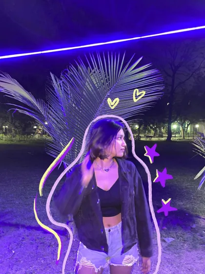 A night photo under some cool blue lights, with doodles that add to the futuristic vibe.