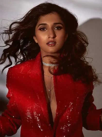 A celebrity look for Nidhhi Agerwal featuring a bold, sequined red blazer. I opted for a bronze smokey eye and a glossy nude lip to create a glamorous, red-carpet-ready look that feels both confident and sophisticated.