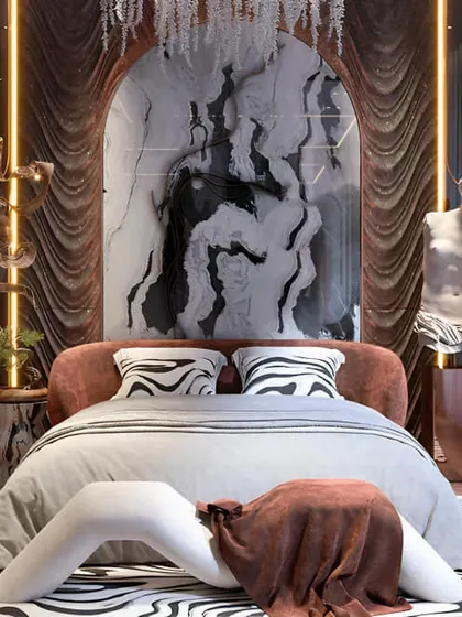 This bedroom is pure drama and luxury. The design features rich textures, a marble and curtained archway, and artistic statues, creating a space that is truly one-of-a-kind.