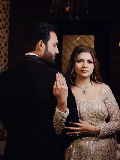 A stylish, moody portrait of a couple ready for their evening event. I use dramatic lighting to create a sophisticated and editorial feel in my photography.