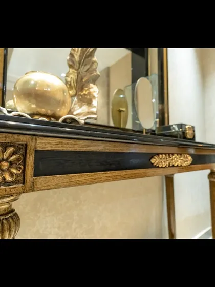 Another detail of the bespoke console table, this time showing the carved floral motif on the leg. I work closely with artisans to ensure every piece of custom furniture reflects the client's individual style and elevates their home.
