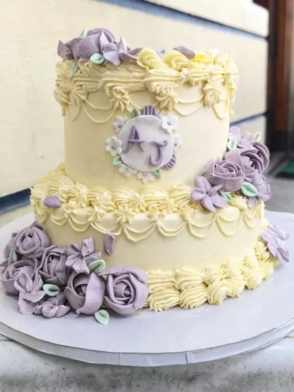 This two-tier vintage engagement cake is one of my absolute favorites. I find the process of creating these intricate buttercream piped details and delicate lavender roses so therapeutic, and the result is a timeless centerpiece for a truly special promise.