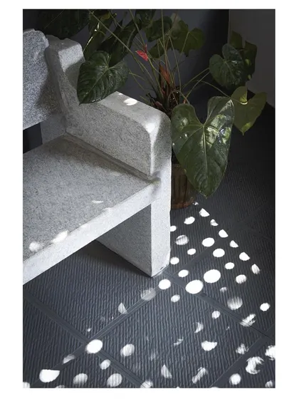 Another perspective on the custom stone bench, where the dappled light creates a serene and contemplative corner within the home.