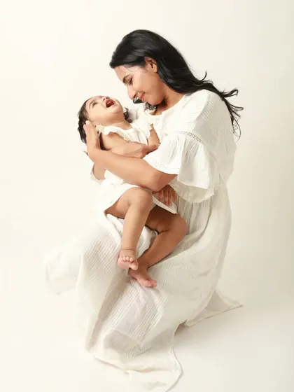 A mother and her youngest daughter share a laugh. Capturing these individual bonds within a family is so important.