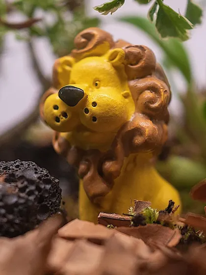 Another angle on the lion figurine, showing how it's placed within the leafy landscape. These terrariums are perfect for baby shower gifts or birth announcements.