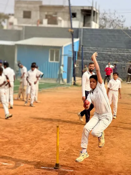A bowler releases the ball with perfect form during a drill. The image highlights the technical aspects of bowling that I focus on with my players.