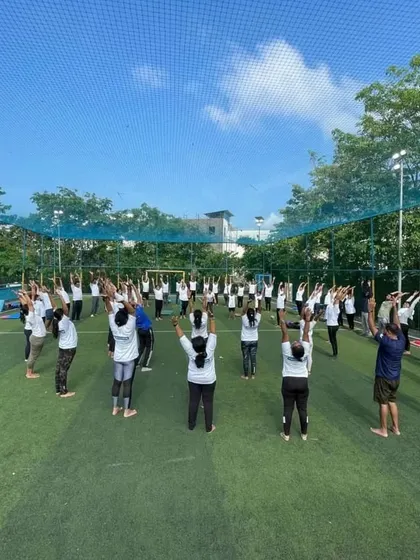 A large group session on an open turf. I am experienced in leading big groups, ensuring everyone feels included and guided throughout the practice.