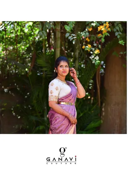 Our gorgeous client Nandu looking pretty in pastels. Her custom hand-embroidered silver blouse pairs beautifully with her lavender-hued saree, creating an elegant and classic ensemble.
