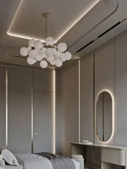 This angle shows the full layout of the bedroom, including the integrated wardrobe and the beautiful lighting design.