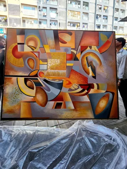 It takes a team to handle a masterpiece of this scale. Here, my assistants carefully carry the finished and framed "The Sounds of Music" painting, ready for delivery to the client.