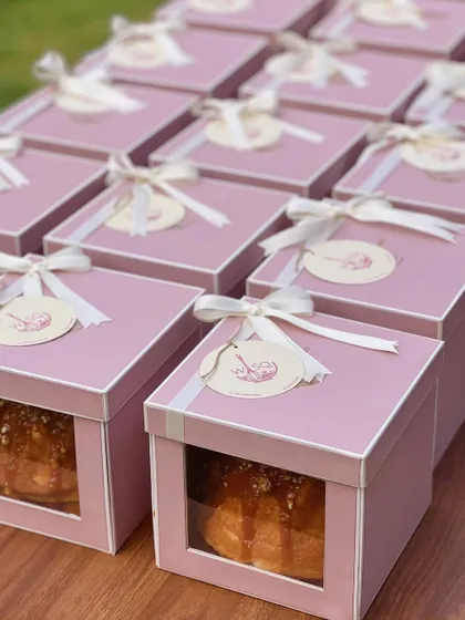 A collection of our baby announcement gift boxes, all lined up and ready to be shared. The consistent and charming presentation makes for a memorable announcement.