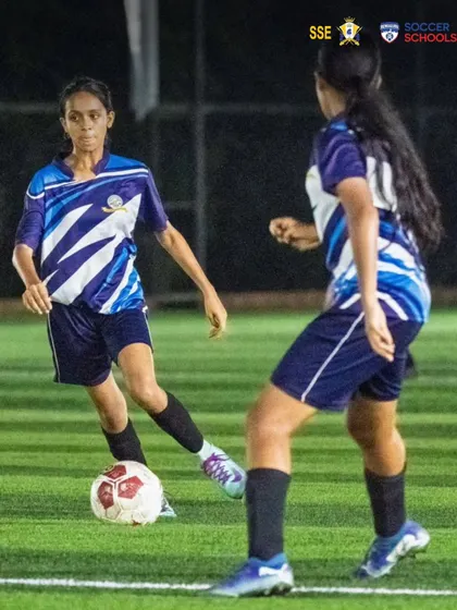 Nizh Kapadia in a one on one situation during a competitive match. We focus on developing players who are confident and decisive on the ball, especially in attacking scenarios.