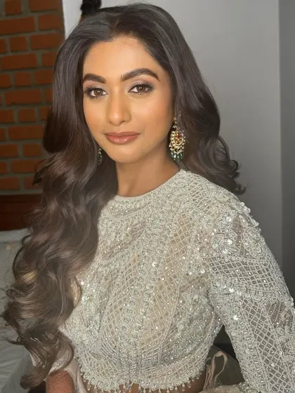 Another angle of this glamorous reception look, showing the flawless skin and defined features.