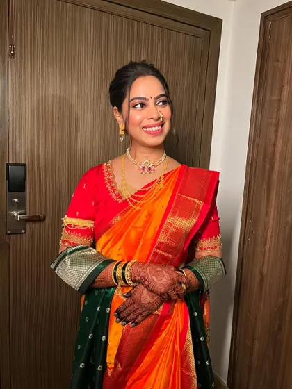 Another joyful portrait of the bride. Her smile is infectious, and the makeup enhances her happiness, giving her a radiant glow.