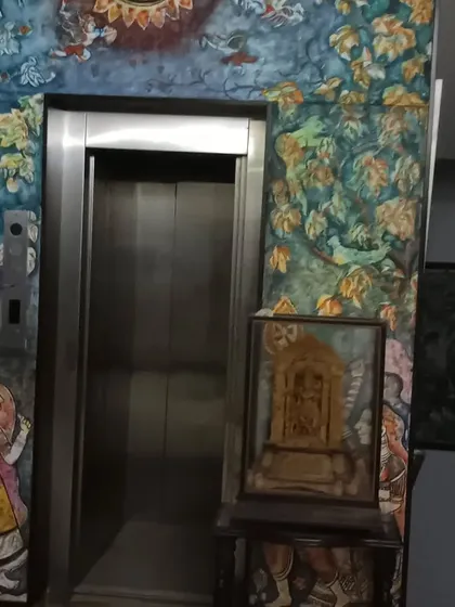 The elevator area in the artist's bungalow, adorned with traditional murals. I ensure that even artistic expressions within a home are in harmony with Vastu principles to maintain a positive and uplifting atmosphere.