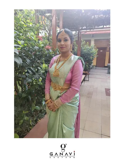 Lavanya in a simple and elegant pose, showcasing her custom blouse and pastel-colored saree. This look is all about understated grace and timeless style.
