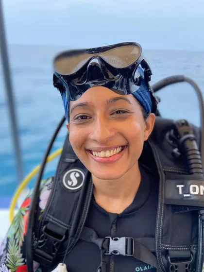 A smiling diver ready for her next adventure. Our community is full of passionate explorers from all backgrounds.